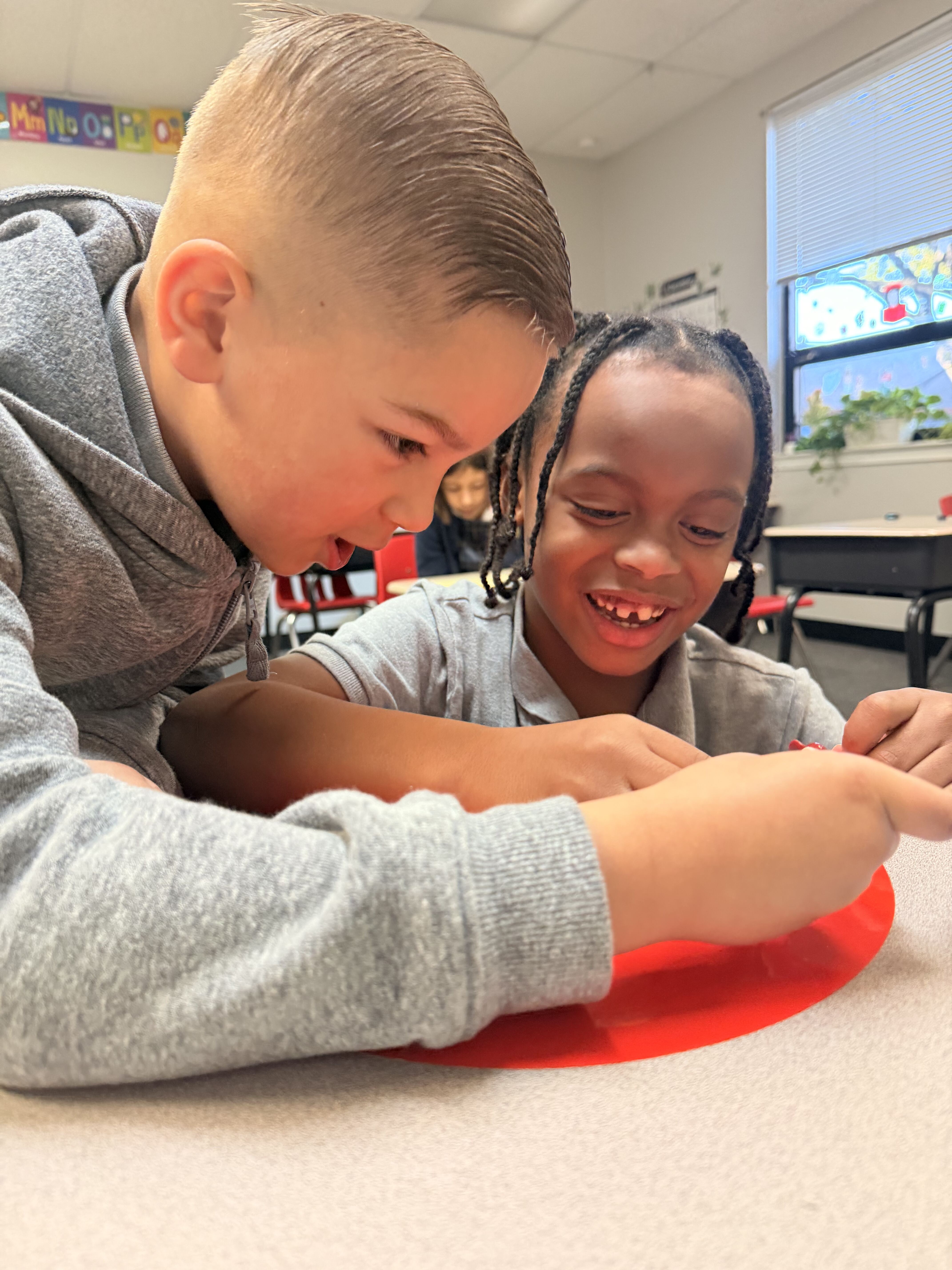 Two students learning together in class
