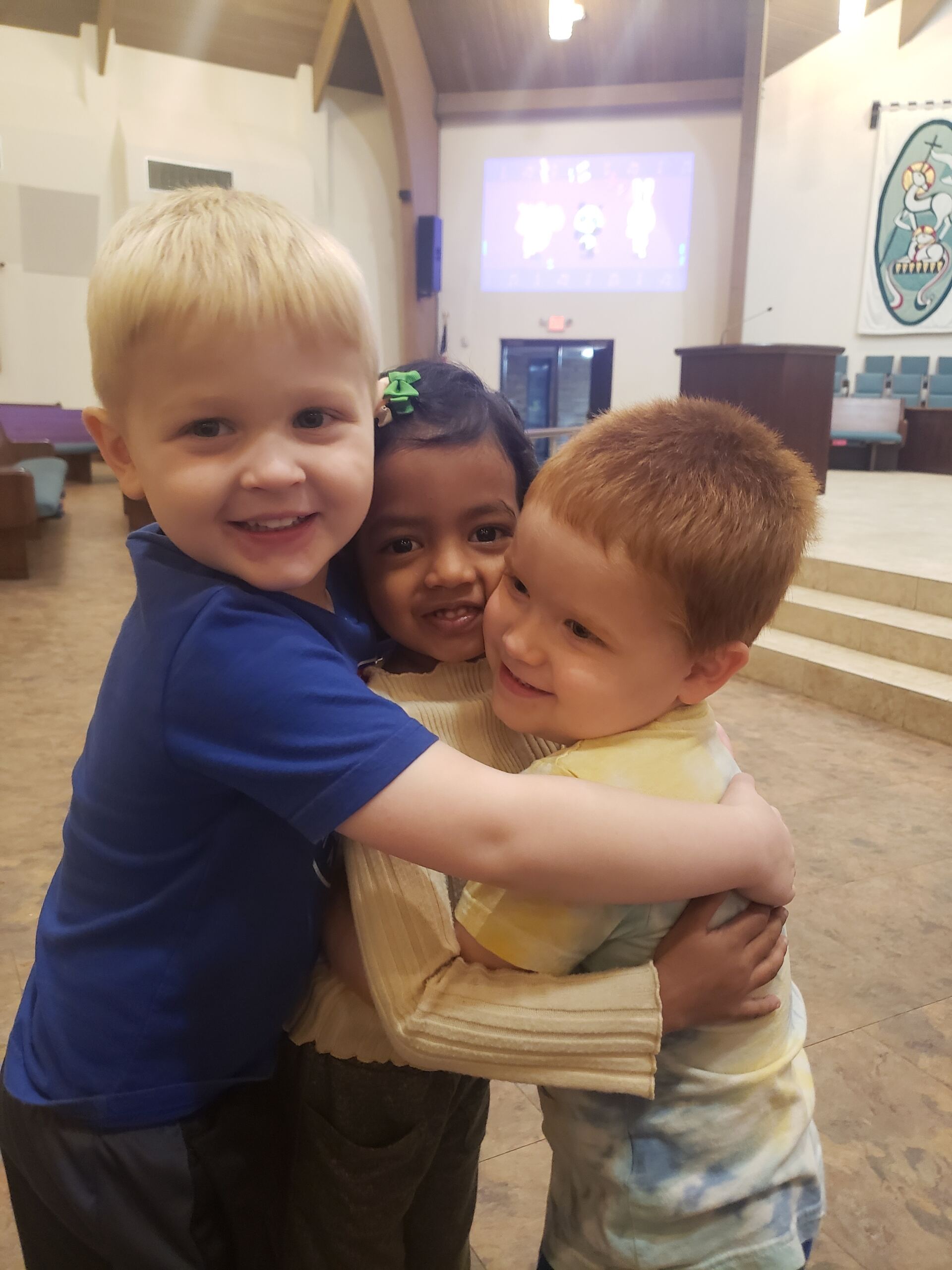 Students hugging in class